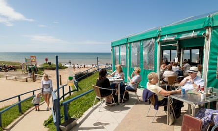 People eating at The Hive Beach Café, Burton Bradstock, Dorset England UK