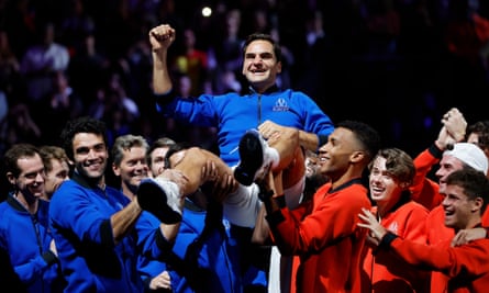 Roger Federer is hoisted high by members of Team Europe and Team World as they celebrate him and his achievements after his final competitive tennis match.