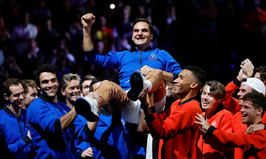 Roger Federer is hoisted high by members of Team Europe and Team World as they celebrate him and his achievements after his final competitive tennis match.