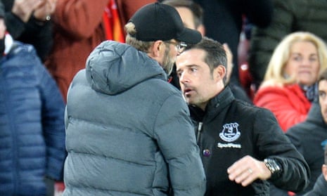 Liverpool manager Jürgen Klopp commiserates with his Everton counterpart Marco Silva.