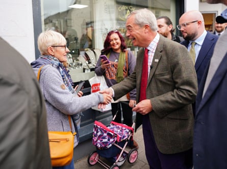 Nigel Farage shaking hands with a woman