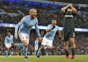 David Silva of Manchester City scores the 2nd city goal as he runs past distraught Pablo Zabaleta of West Ham United during the close 2 v 1 victory at the Etihad Stadium.