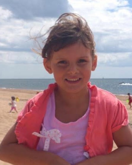 Tamzin Hall on the beach as a child