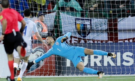 Jack Butland dives to his right to prevent an own goal by his team-mate Michael Keane in England’s 1-0 win against Lithuania in Vilnius.
