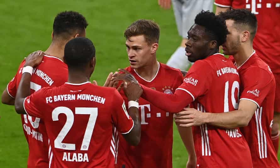 Joshua Kimmich celebrates with his Bayern teammates after scoring their second goal