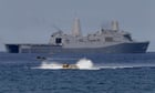 China vows action after US warship sails near South China Sea island