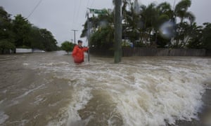Amelia Rankin in floodwaters in Hermit Park, Townsville