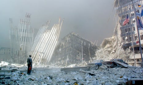 A man stands amid the rubble of the World Trade Center on 11 September 2011.