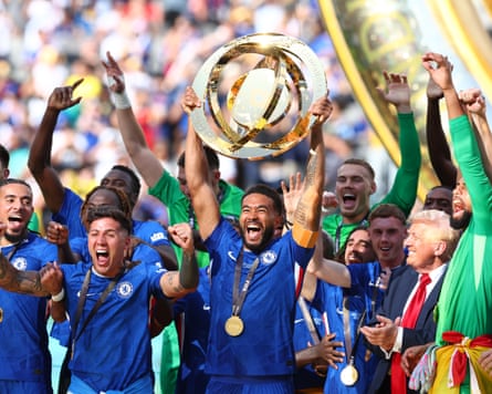 Reece James lifts the trophy alongside his Chelsea teammates