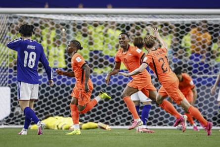 Crysencio Summerville (left) celebrates aft scoring Netherlands’ 2nd extremity against Japan.