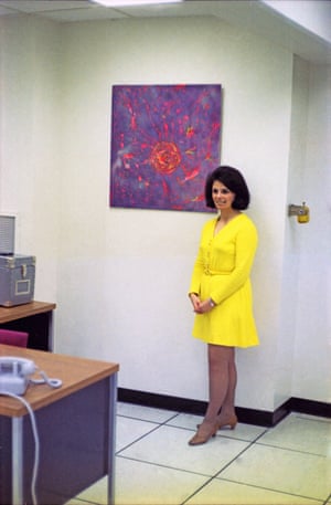Bell Labs worker Barbara poses in front of her artwork