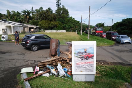 Residents monitor the entrance to their neighbourhood near a gas station to prevent vandalism attempts during the night in Monte-Dore in France’s Pacific territory of New Caledonia on 10 June 2024