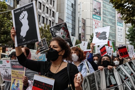 Protesters against Iran’s religious police march through Shibuya district of Tokyo, Japan on Saturday.