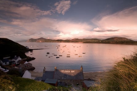 A bay and stormy skies over the roof of a famous pub.