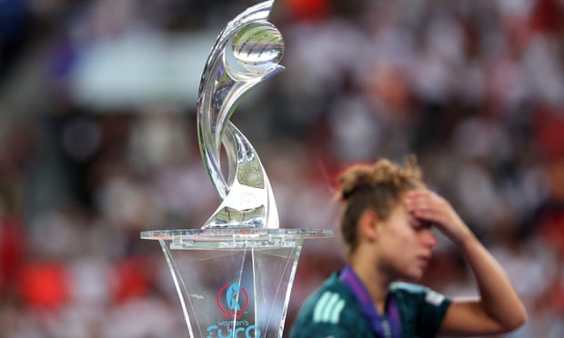 German player looks sad near trophy