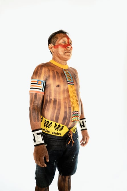 Flechas wears traditional decorations including body painting
