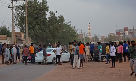 People gather on the street in east Khartoum amid a humanitarian pause in the fighting.