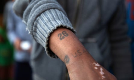 A member of the Americans and of the 26 prison gang shows his tattoos in Bonteheuwel.