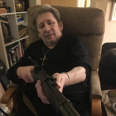 Shane MacGowan with his beloved rifle.