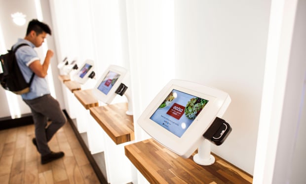 A customer uses an iPads to place and pay for his order at Eatsa, a fully automated restaurant in San Francisco.
