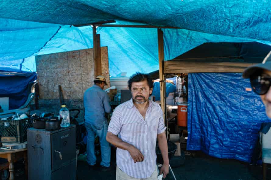 Roberto Lopez inside the kitchen at the Community of Grace encampment near a Home Depot in Oakland.