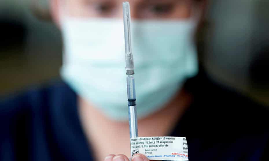 Health worker with Pfizer vaccine