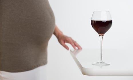 Pregnant Woman with Glass of Wine