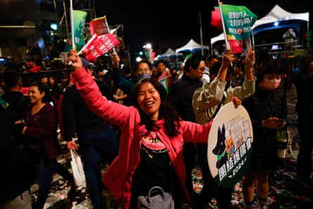 A supporter of the Democratic Progressive party (DPP) dances during a rally, following the victory of Lai Ching-te.