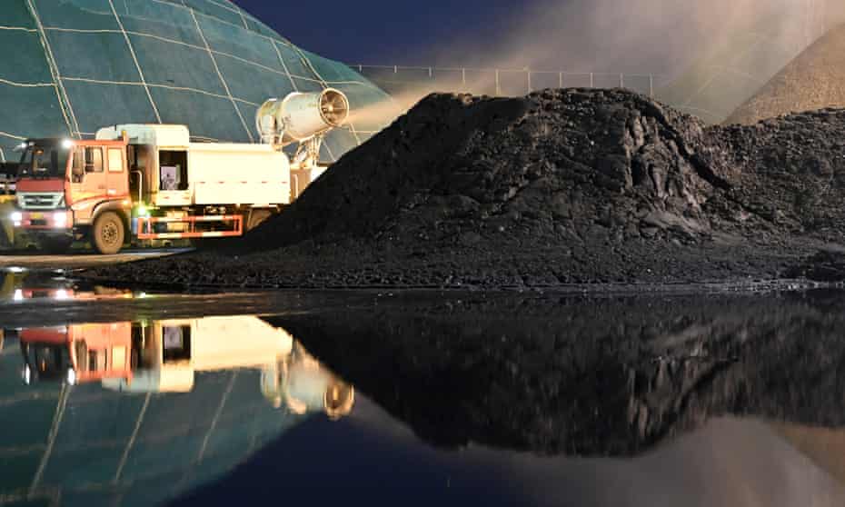 Engineers operating at the coal dock in Tianjin port, China.