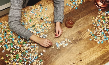 Cropped Hands Of Woman Playing Jigsaw