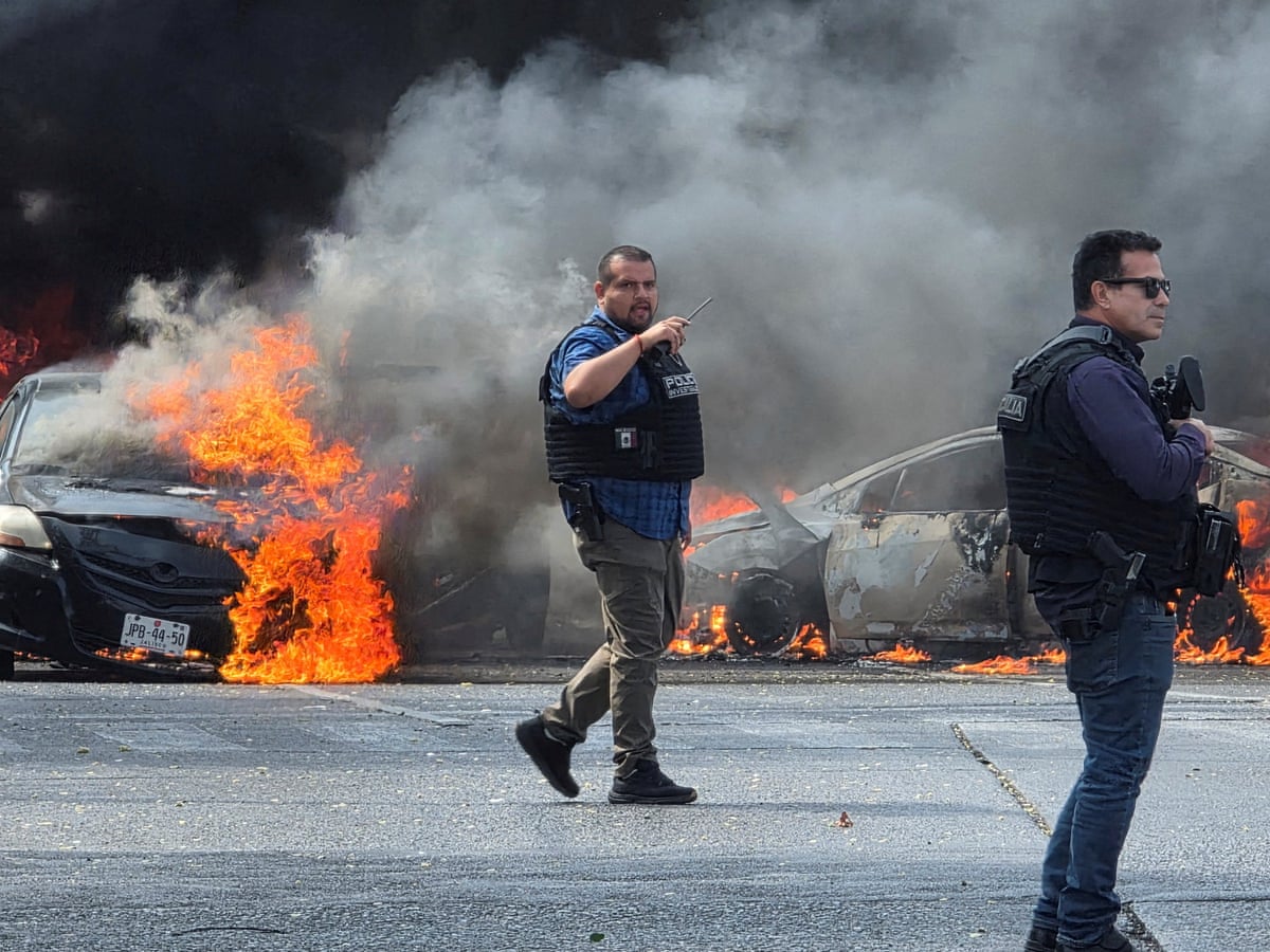 Violence erupts after Mexican security forces kill drug cartel boss `El Mencho` | Mexico | The Guardian