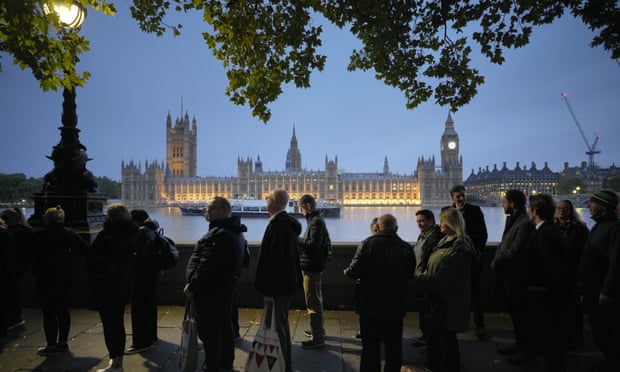 People queue to pay their respect to the late Queen Elizabeth II during the Lying-in State, at Westminster Hall in London, Thursday, Sept. 15, 2022. The Queen will lie in state in Westminster Hall for four full days before her funeral on Monday Sept. 19. (AP Photo/Markus Schreiber)