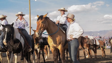 people gather on mules
