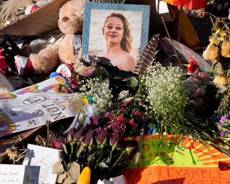 Flowers and photos left at a memorial site for Renee Good on 31 January in Minneapolis.