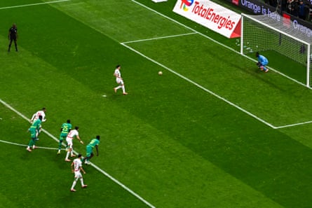 A wide view of the Morocco forward Brahim Díaz just after he has taken a Panenka penalty which is on its way to being saved by the Senegal keeper Édouard Mendy in the Afcon final of 2026.