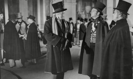 Alastair Sim (centre) as Scrooge in the 1951 film of A Christmas Carol.