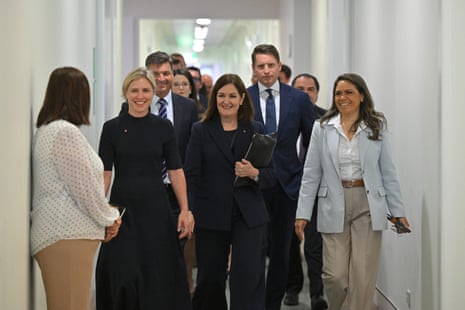 Liberal senators Jessica Collins, Sarah Henderson and Jacinta Nampijinpa Price walk in front of shadow defence minister Angus Taylor and Liberal MP Andrew Hastie