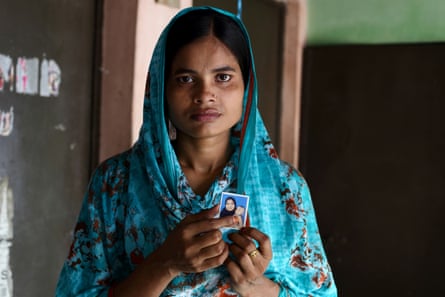 Tania holds the only photograph she has of her daughter, who she only sees twice a year.