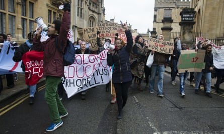 Protesters demand the removal of the Cecil Rhodes statue from the front of Oriel College, Oxford.