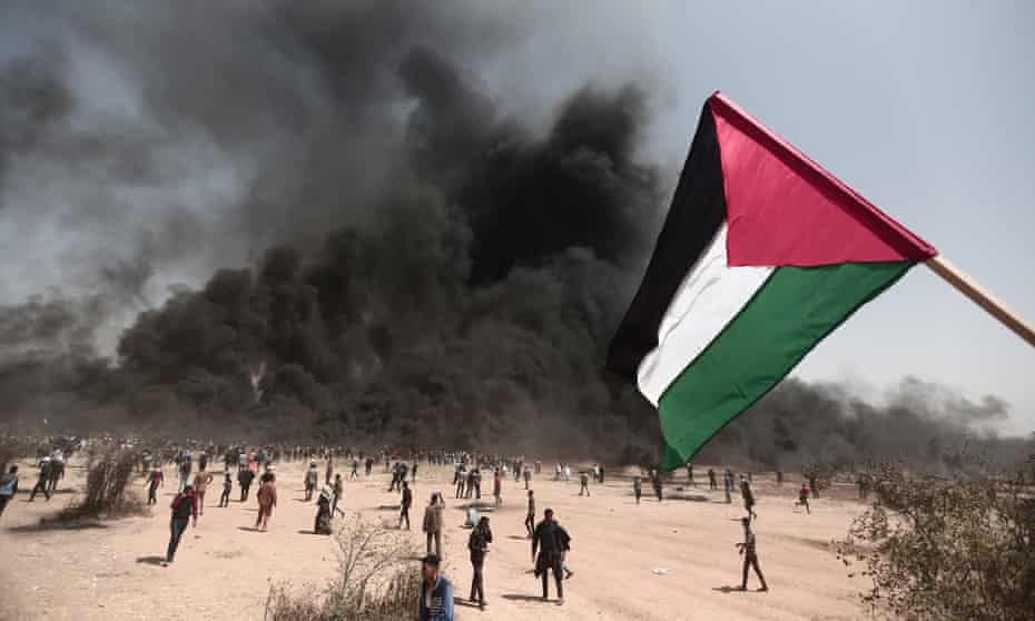 Palestinians stage a demonstration at the Great March of Return near the Gaza/Israel border in 2018.