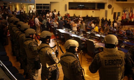 Soldiers stand inside El Salvador’s national congress as President Nayib Bukele addresses a special session to push for the approval of funds for a government security plan on 9 February.