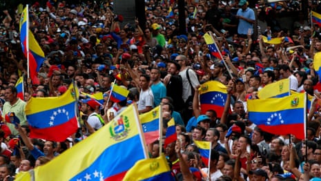Venezuela: Juan Guaidó declares himself interim president after mass protests – video report
