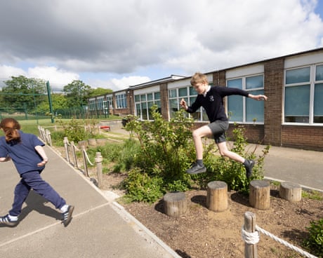 ‘It’s put the joy levels up’: the flood-prone London school with a climate-adapted playground