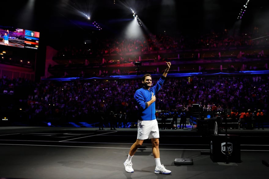 An emotional Roger Federer acknowledges the crowd’s applause following his final competitive tennis match.