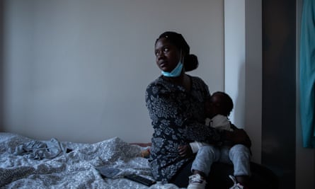 Dulce and her baby at an emergency hostel they were placed in after losing their home in Loures, a municipality in the Greater Lisbon region