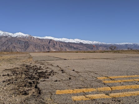 view of beat-up tarmac in front of mountains