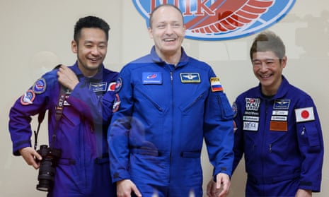 Roscosmos cosmonaut Alexander Misurkin (centre), with Japanese space tourists Yozo Hirano (left) and Yusaku Maezawa (right) at a news conference before the launch of the Soyuz MS-20 spacecraft