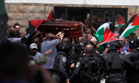 Police clash with mourners carring the coffin of the American-Palestinian journalist Shireen Abu Aqleh outside St Joseph’s hospital in East Jerusalem.
