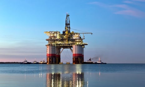 A photo of “Big Foot”, Chevron's deep ocean oil rig, departing Kiewit Industries at dawn, in 2018.