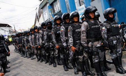 Police leave the El Inca prison after a security operation in response to riots on Monday.